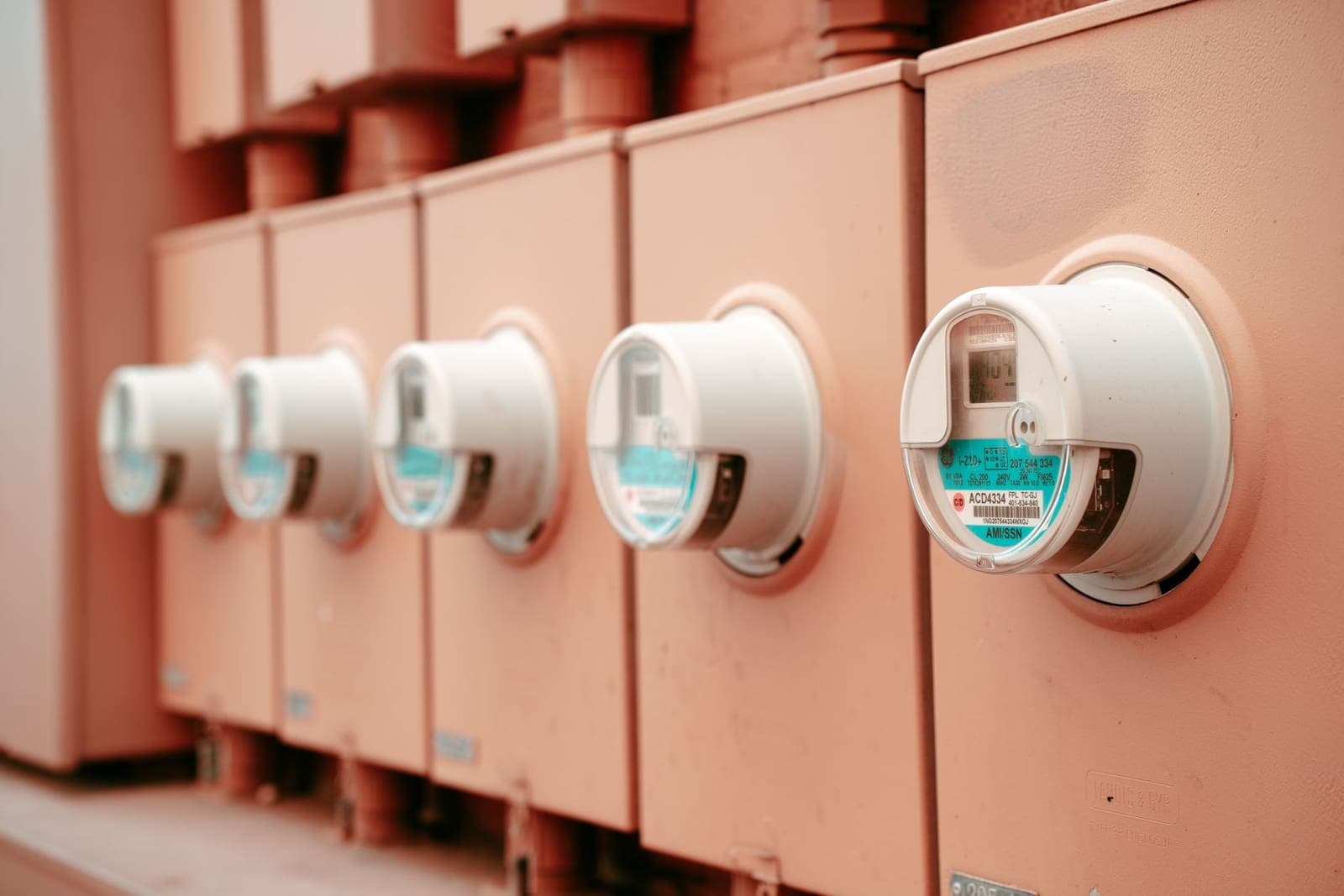 A row of electricity meters mounted on a wall